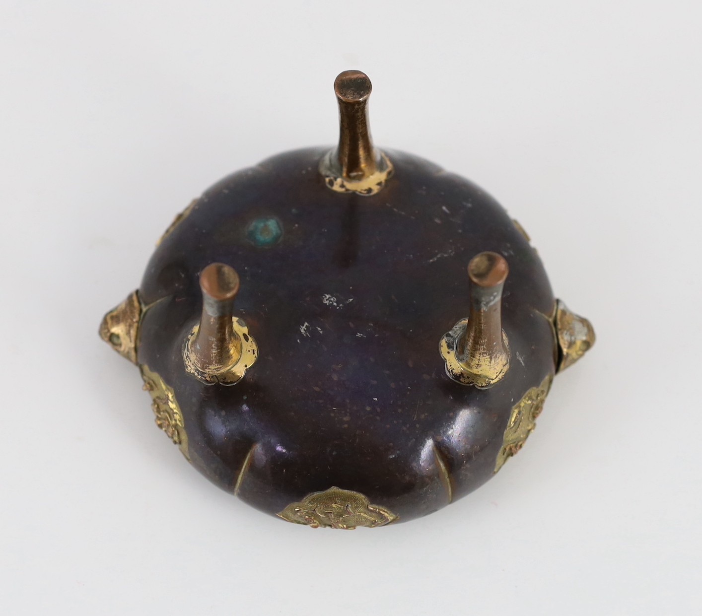A Chinese Imperial copper alloy censer, ding, 18th century, 12cm wide 7cm high, ring handles and cover lacking, some wear.